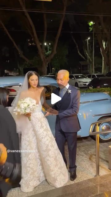 the bride and groom are getting ready to walk down the aisle