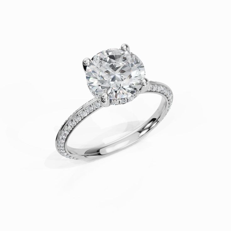 a diamond engagement ring on a white background