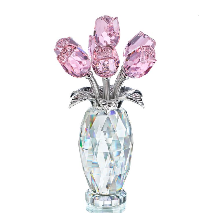 a crystal vase with pink flowers in it on a white background and the bottom is clear