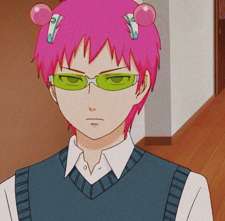 an anime character with pink hair and green eyeglasses in front of a wooden floor