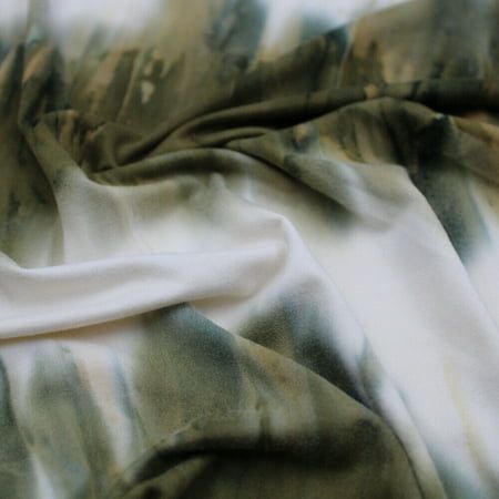 the fabric is green and white in color