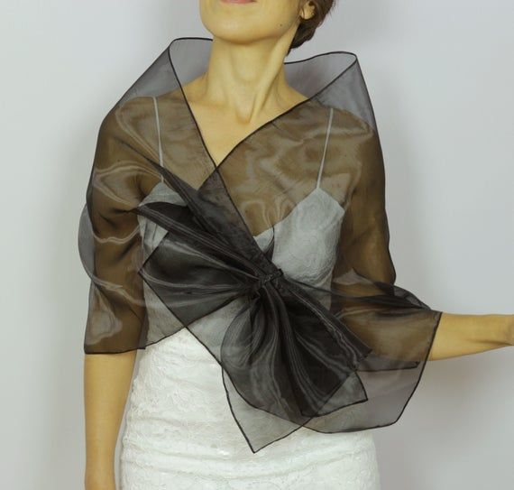 Black organza shawl, Shoulder wrap scarf, Mesh evening dress topper, Pull through mother of the bride stole, Hands free formal cover upIt's made with black organza fabric.A detail is added to be able to use it "hands-free".Rectangular shaped, it measures approximately 18.5’’x56.7’’ (47x144 cm)Size: SWith its elegant and refined look, it can be worn during the day at the office or at a cocktail reception etc.For more similar wedding & evening cover-ups, please kindly visithttps://www.etsy.com Fitted Black Shawl For Wedding, Sheer Shawl For Evening, Elegant Black Shawl For Wedding, Elegant Organza Shawl For Evening, Elegant Black Wedding Shawl, Formal Organza Shawl, Elegant Sheer Shawl For Parties, Elegant Sheer Shawl For Evening, Elegant Sheer Shawl For Wedding