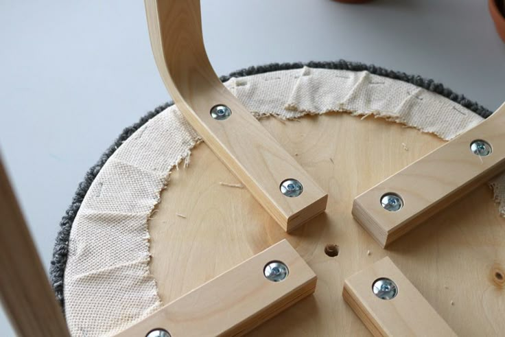 a close up of a wooden object with metal studs on it's sides