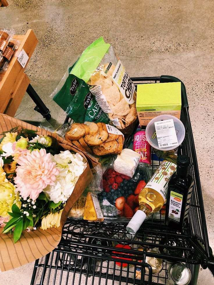 a shopping cart filled with assorted food items