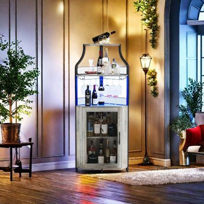 a living room filled with furniture and a wine cabinet