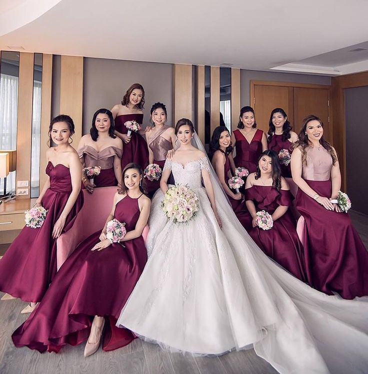 a bride and her bridal party posing for a photo