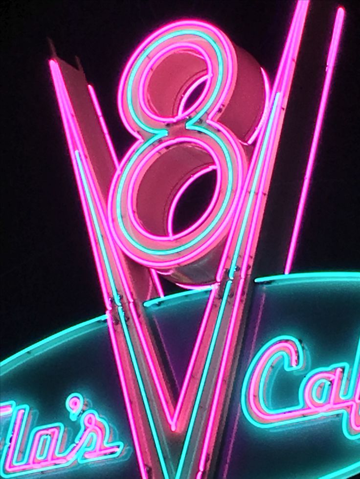 a neon sign that reads'80 years cafe '