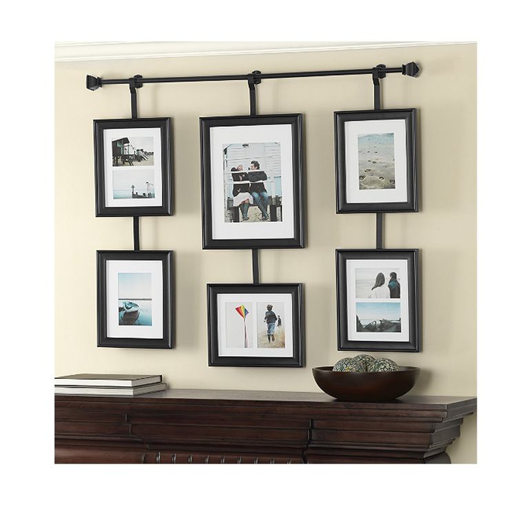 a set of six black and white framed pictures hanging on the side of a wall