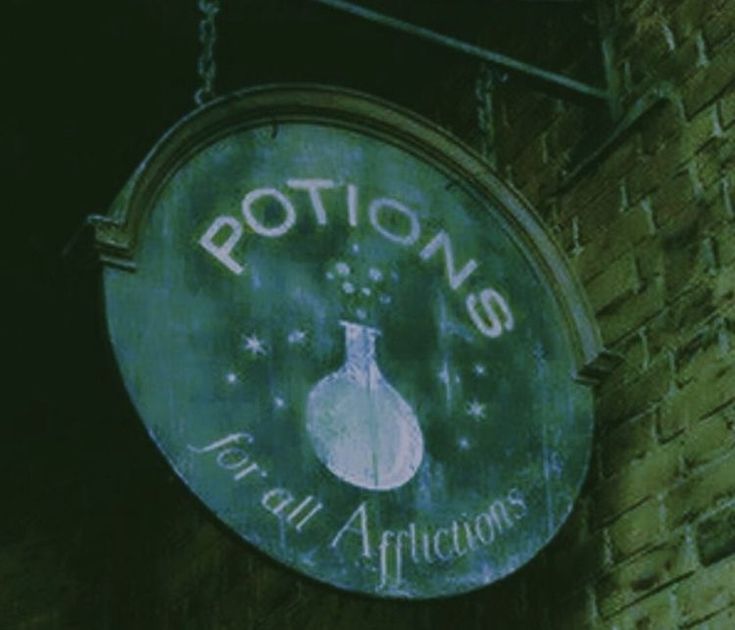 a sign hanging from the side of a brick building that says potions for all africtors