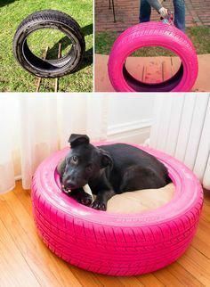 a black dog laying in a pink tire bed made out of old tires and another photo