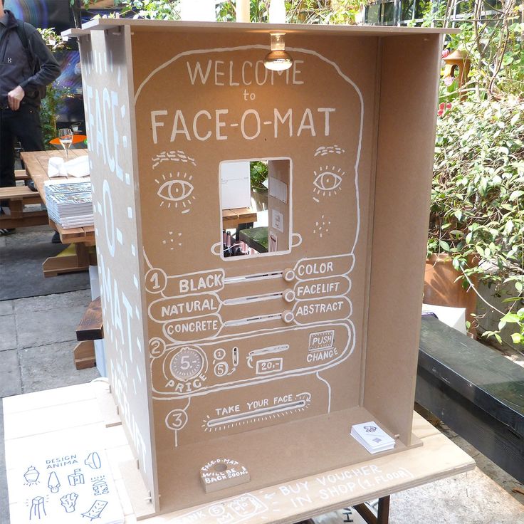 a cardboard box with an image of a face - o - mat drawn on it