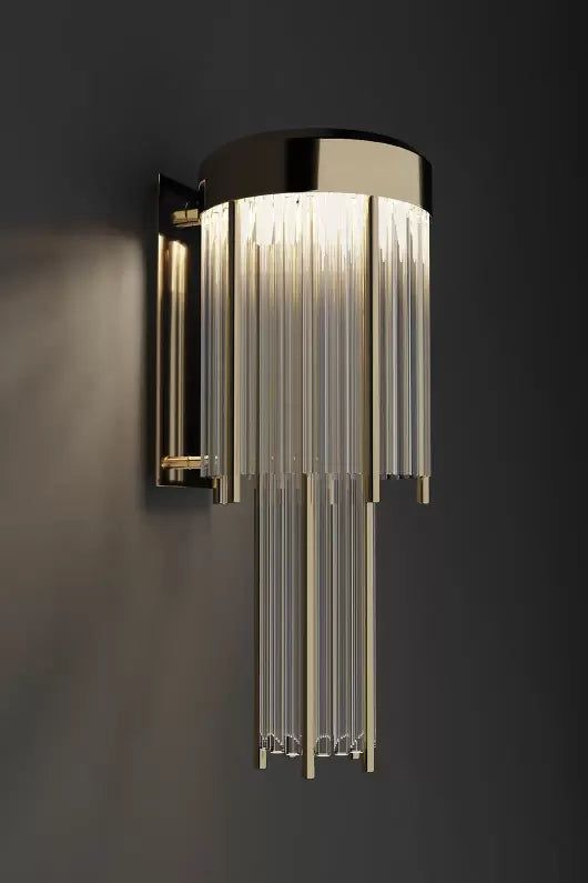 a modern wall light that is hanging on the side of a wall in a dark room