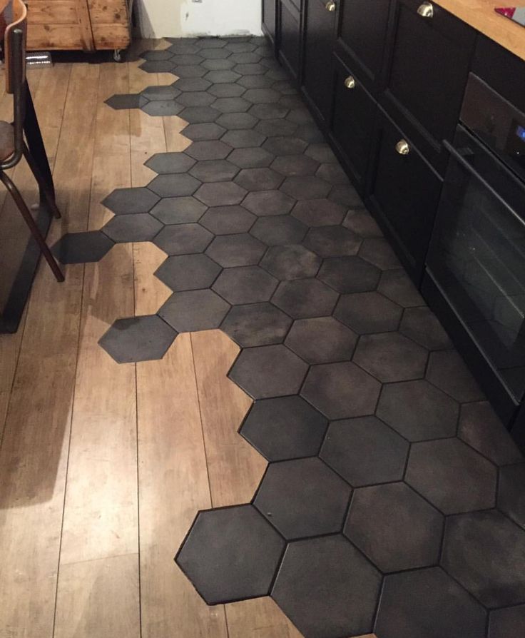 a kitchen floor with hexagonal tiles on it