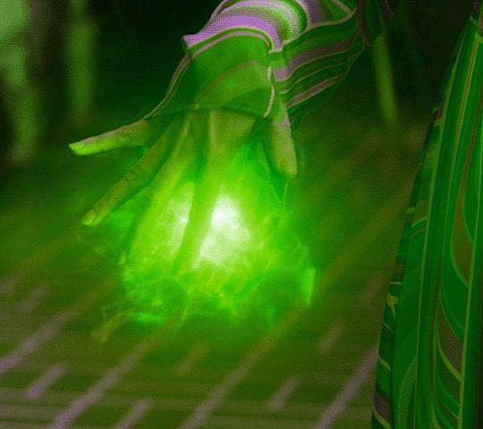 a person wearing green gloves holding a glowing object