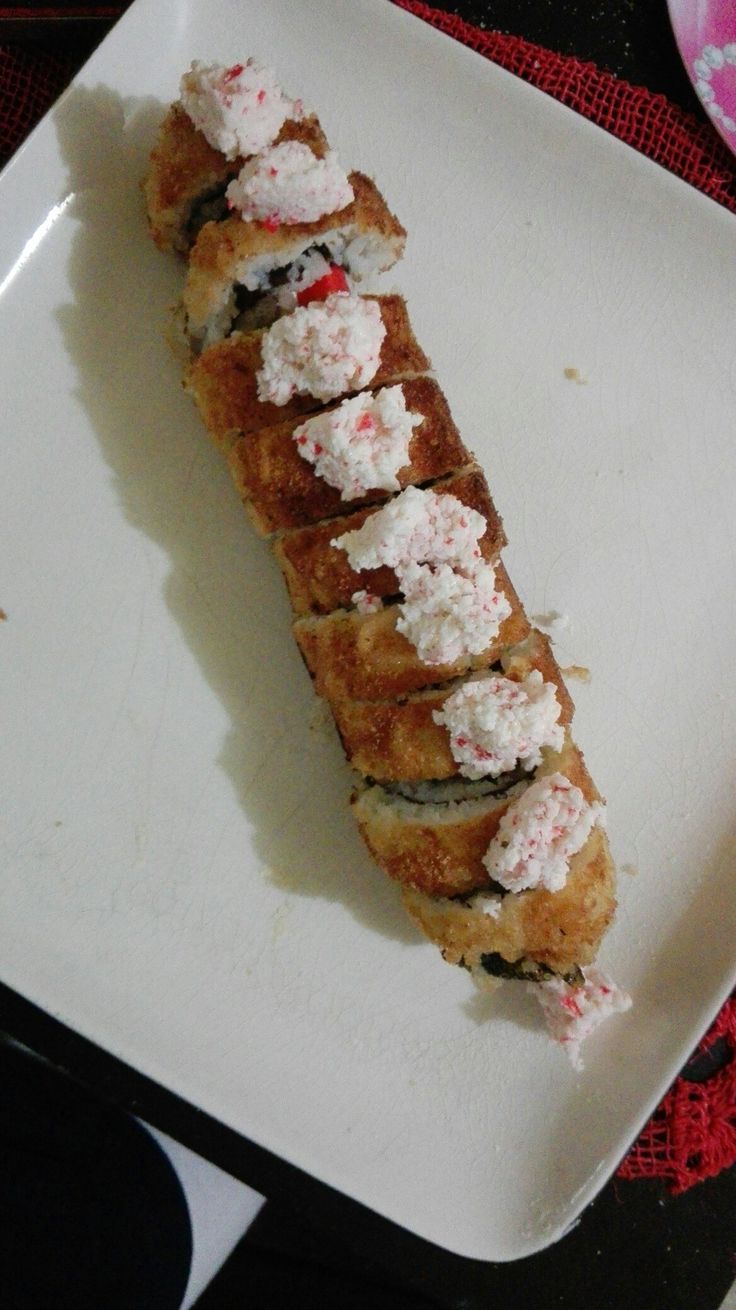 a white plate topped with food on top of a table