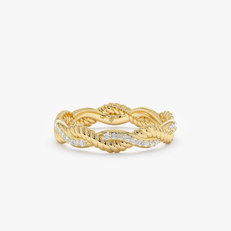 a yellow gold ring with white diamonds on the sides and a twisted design in the middle