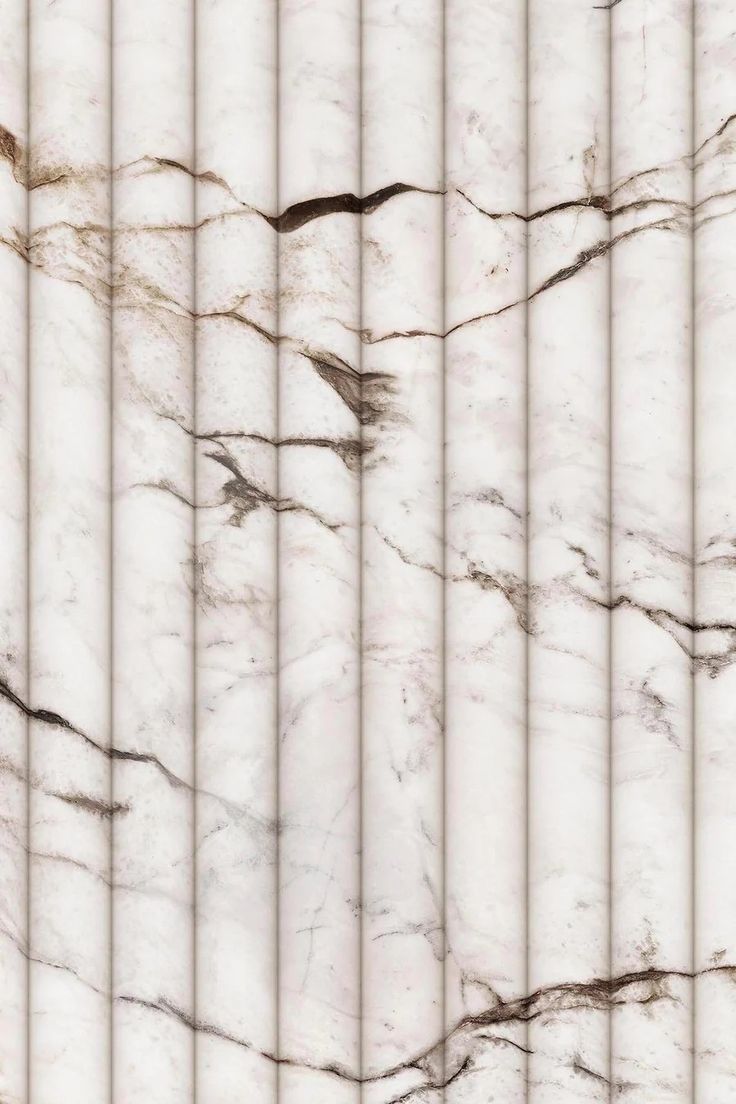 a white marble textured background with vertical lines