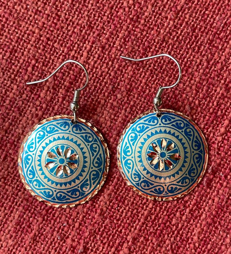 These traditional handmade earrings are made with a type of handiwork that dates back to the 17th Century in the Ottoman Empire. The gorgeous craftsmanship is rare and only 8 people are capable of this kind of handiwork today. Because of this, the craft of etching in copper is estimated to last for only another 10-15 years.  These are classic and timeless designs. The hooks of the earrings are Stainless Steel, and the jewellery itself is 100% Copper, which make them so lightweight. The backs are coated with Silver Nitrate, and both sides are polished with a high quality varnish so these pieces will not tarnish or discolour, are hypo-allergenic, and will hopefully get you compliments for time to come! Artisan Handmade Blue Earrings, Artisan Blue Earrings, Handmade Artisan Blue Earrings, Handmade Blue Beaded Metal Earrings, Multicolor Round Copper Jewelry, Artisan Blue Beaded Round Earrings, Handmade Artisan Blue Beaded Earrings, Blue Artisan Copper Earrings, Artisan Blue Copper Earrings