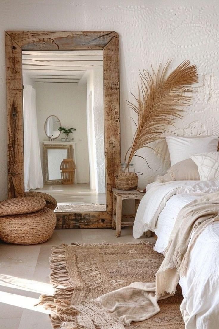 a bedroom with a bed, mirror and rugs on the floor in front of it