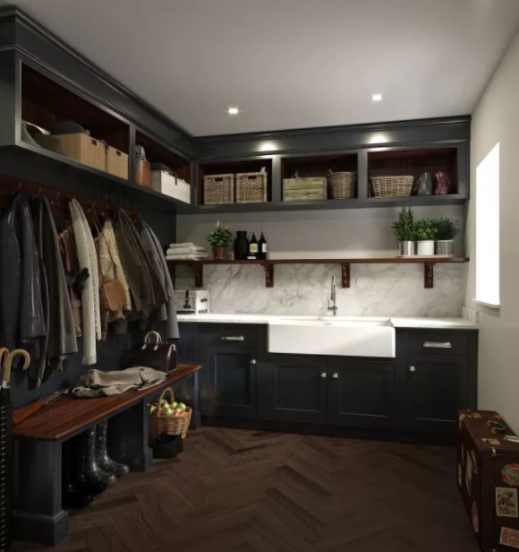 a kitchen filled with lots of wooden cabinets