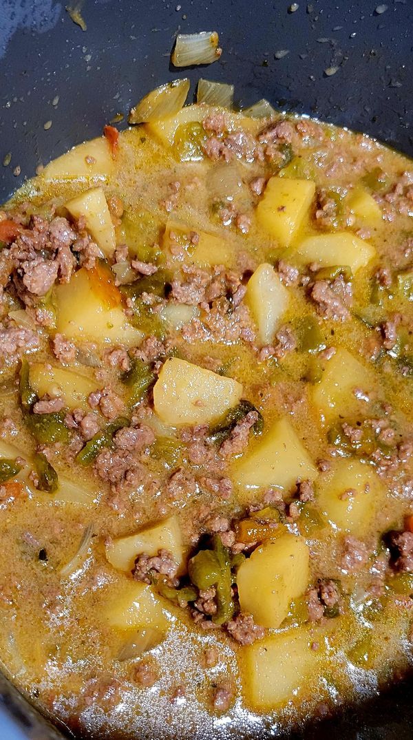 the food is prepared and ready to be cooked in the pot on the stove top