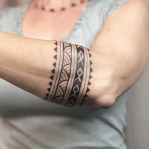 a woman with a tattoo on her arm