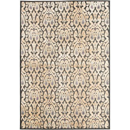 a rug with an intricate design on the front and back side, in black and white