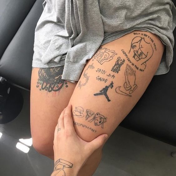 a person with tattoos on their legs