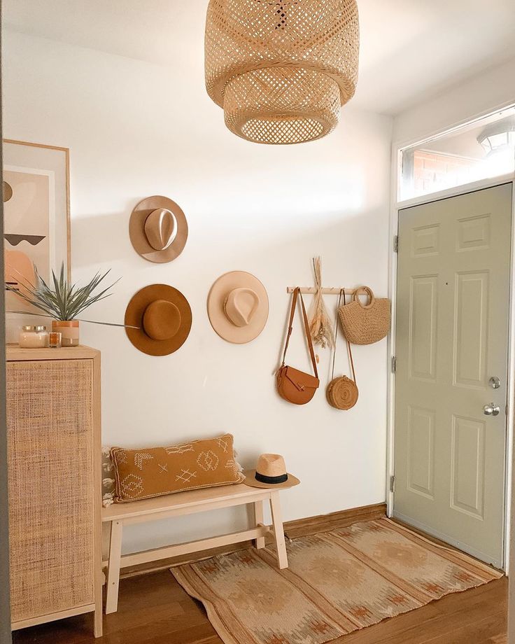 hats are hanging on the wall in this entryway