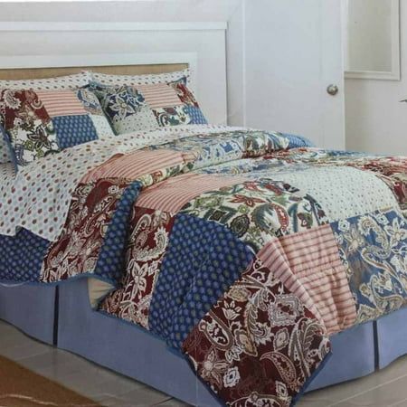 the bed is made up with many different patterns