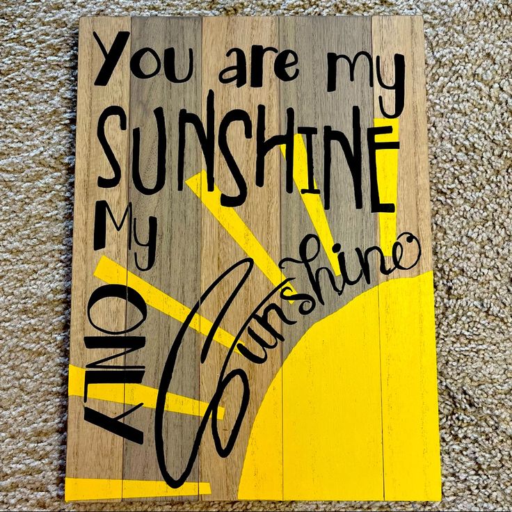 a wooden sign with the words you are my sunshine on it