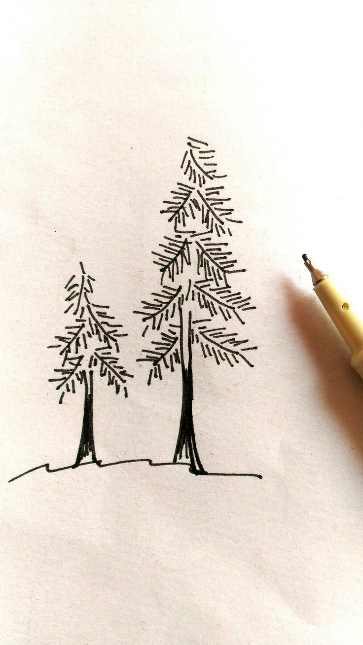 a drawing of two trees on paper next to a yellow pencil and eraser pen