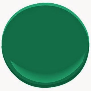 a close up of a green paint color on a white background, with the top half painted in bright green