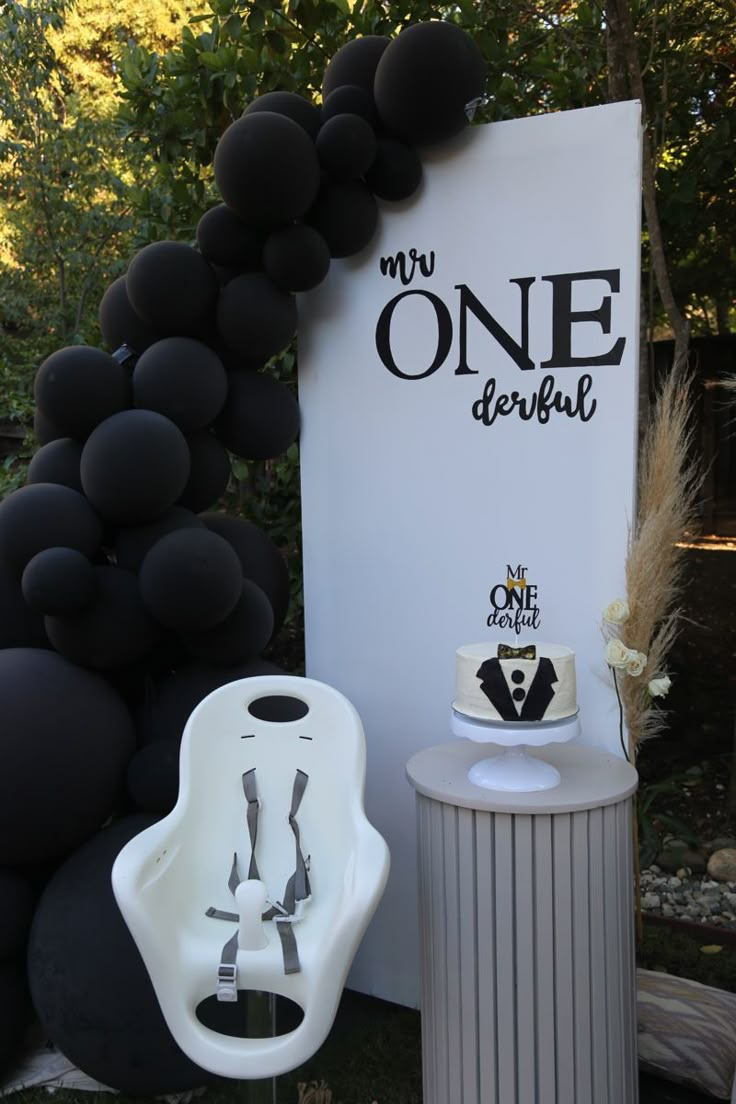 a baby's first birthday party with black and white decorations