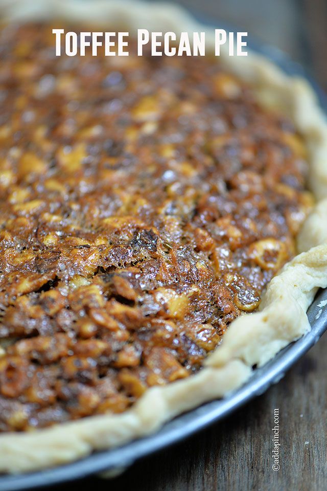 a pecan pie sitting on top of a wooden table with text overlay that reads toffe pecan pie