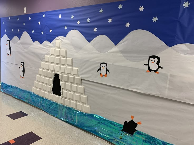 this is an image of a classroom wall decorated with penguins and ice floese