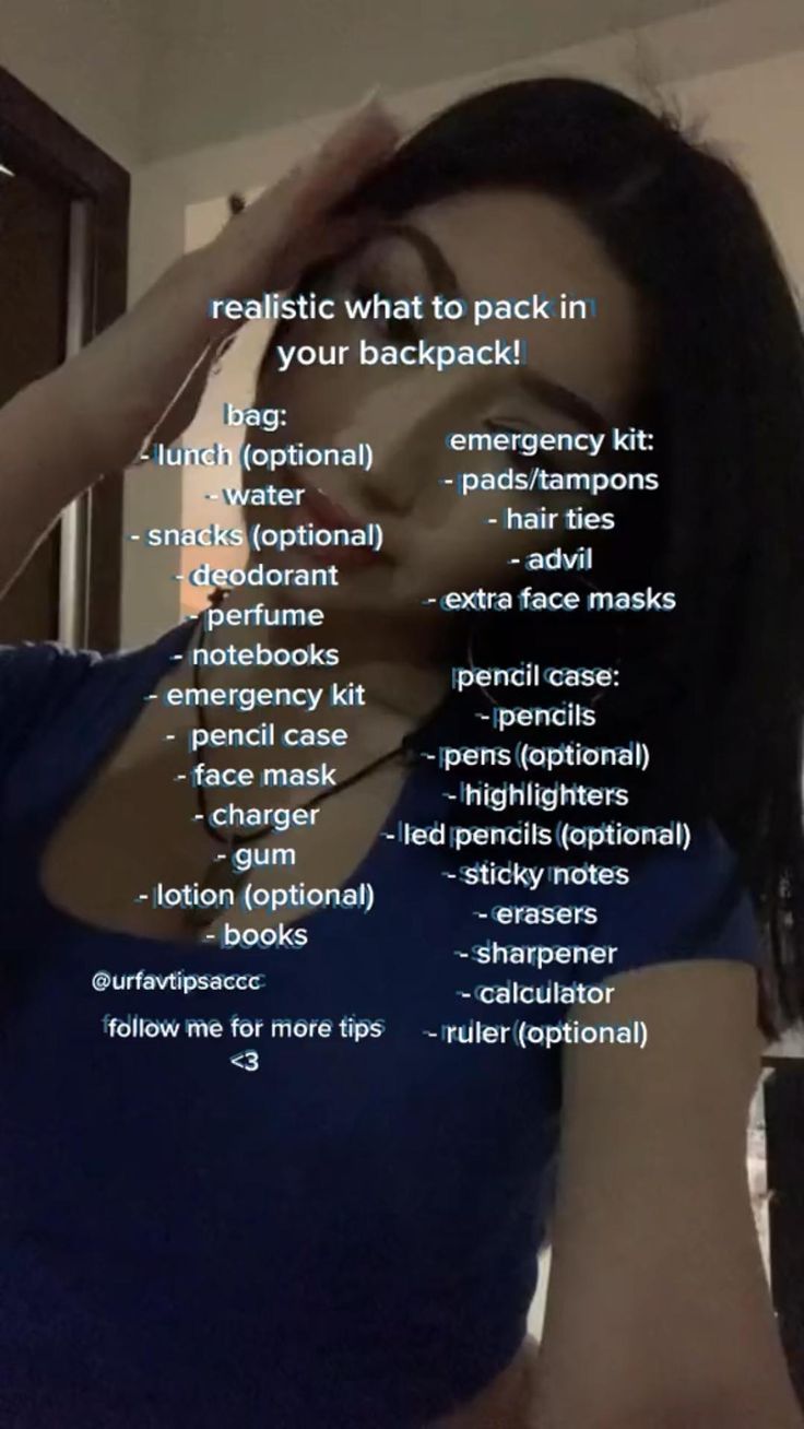 a woman in a blue top is holding her hair up to her face with the words on it