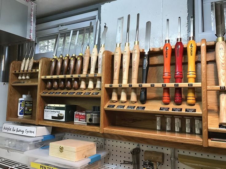 baseball bats are lined up on shelves in a shop