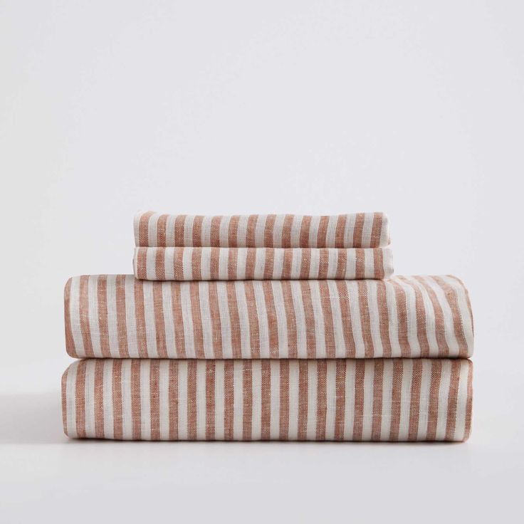 three striped towels stacked on top of each other