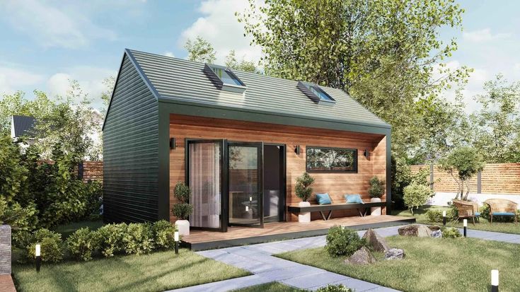 Modern prefab ADU with pitched roof and large bi-fold door with deck and bench Adu Building, Modern Farmhouse Adu, Detached Adu Ideas, Studio Adu, Backyard Adu, Adu Ideas, Kitchen Cabinet Interior, Accessory Dwelling Unit, Gable Roof