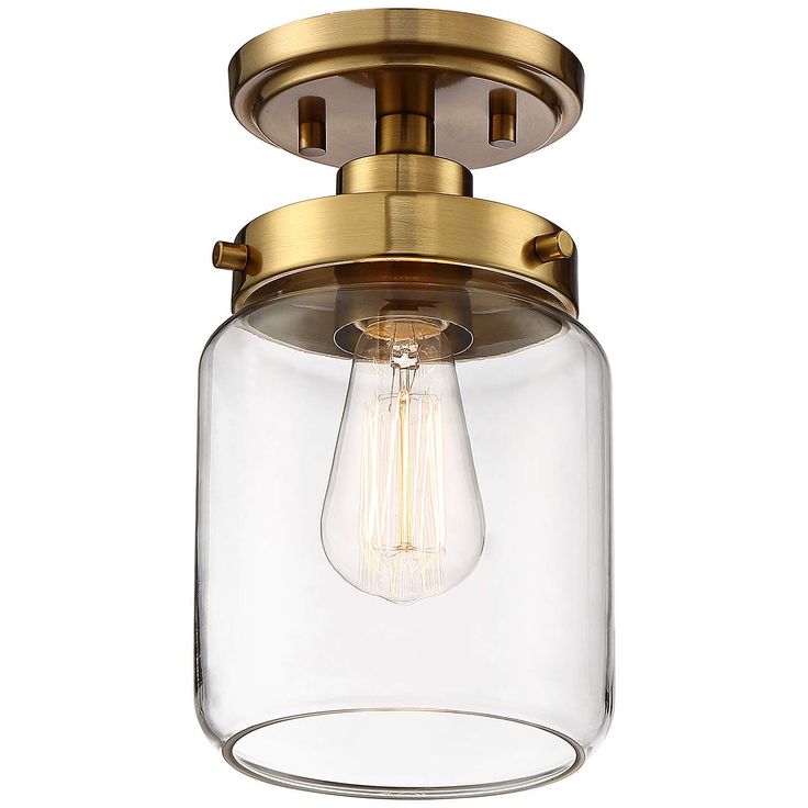 a light fixture with a clear glass shade