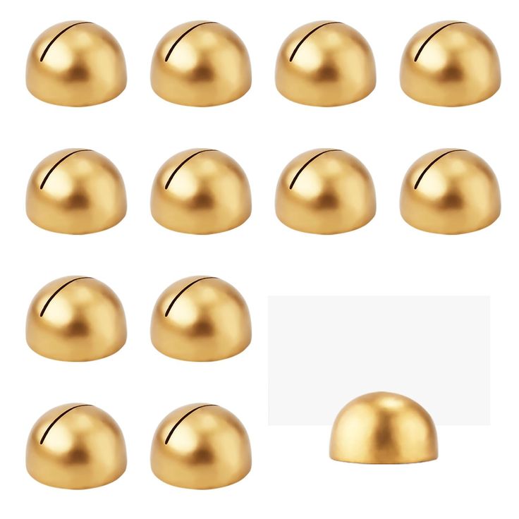 gold balls are arranged on a white background