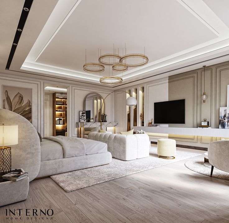 an elegant living room with white furniture and gold accents on the walls, along with a large flat screen tv