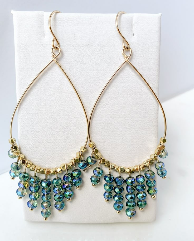 Are you looking for a unique and beautifully handcrafted accessory? Look no further than these handmade Gold Beaded Teardrop Hoop Earrings! As a single artisan handmade business based in California, I take pride in creating each pair of earrings with the utmost care and attention to detail.  Measuring approximately 3 inches long (including ear wire) and 1.25 inches wide, each hoop is beaded with multifaceted cut beads on 14k gold-filled wire.  Each ear wire is also handmade of 14k gold-filled.  The 14k gold-filled is manufactured in the USA.  Gold-filled is of higher quality and will last for years without tarnishing. I believe in the quality of my work, which is why I offer a Happiness Guarantee. If for any reason you're not completely satisfied with your purchase, you can return it withi Jewelry For Prom, Hummingbird Perch, Teardrop Hoop Earrings, Jewelry Making Classes, Hoop Earrings Handmade, Statement Hoop Earrings, Beaded Earrings Diy, Artisan Gift, Wire Work Jewelry