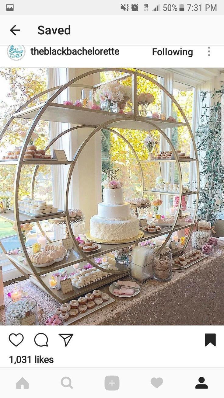 a table topped with lots of cakes and cupcakes