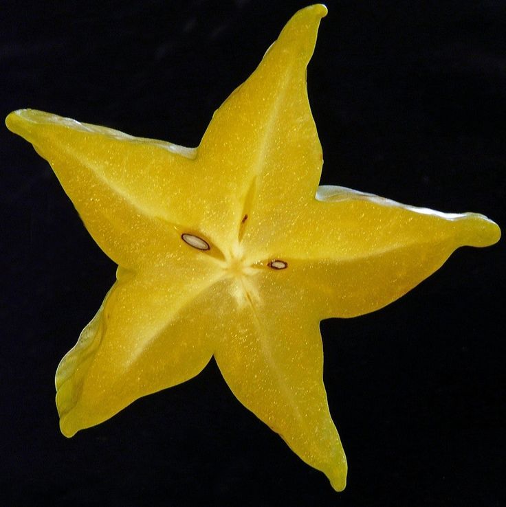 a yellow star shaped object floating in the air