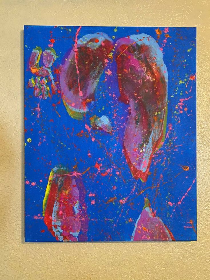 an abstract painting on a wall with blue and pink colors