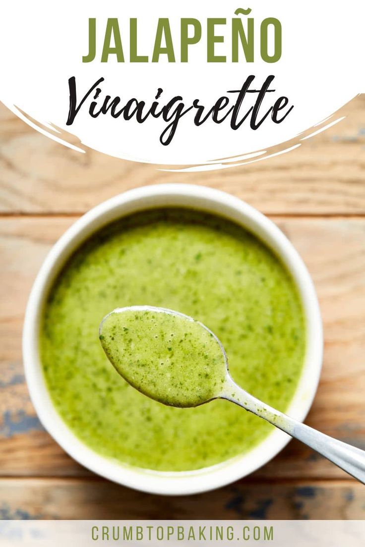 a white bowl filled with broccoli soup on top of a wooden table and the words jalapeno vinaigrete above it