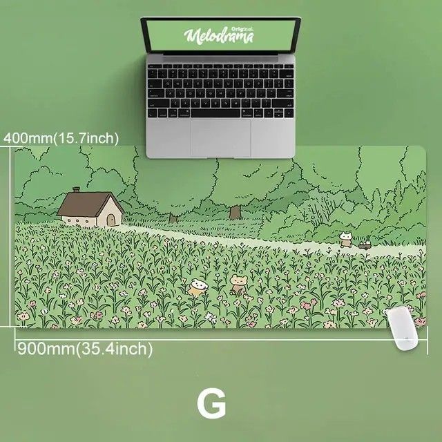 a laptop computer sitting on top of a green field