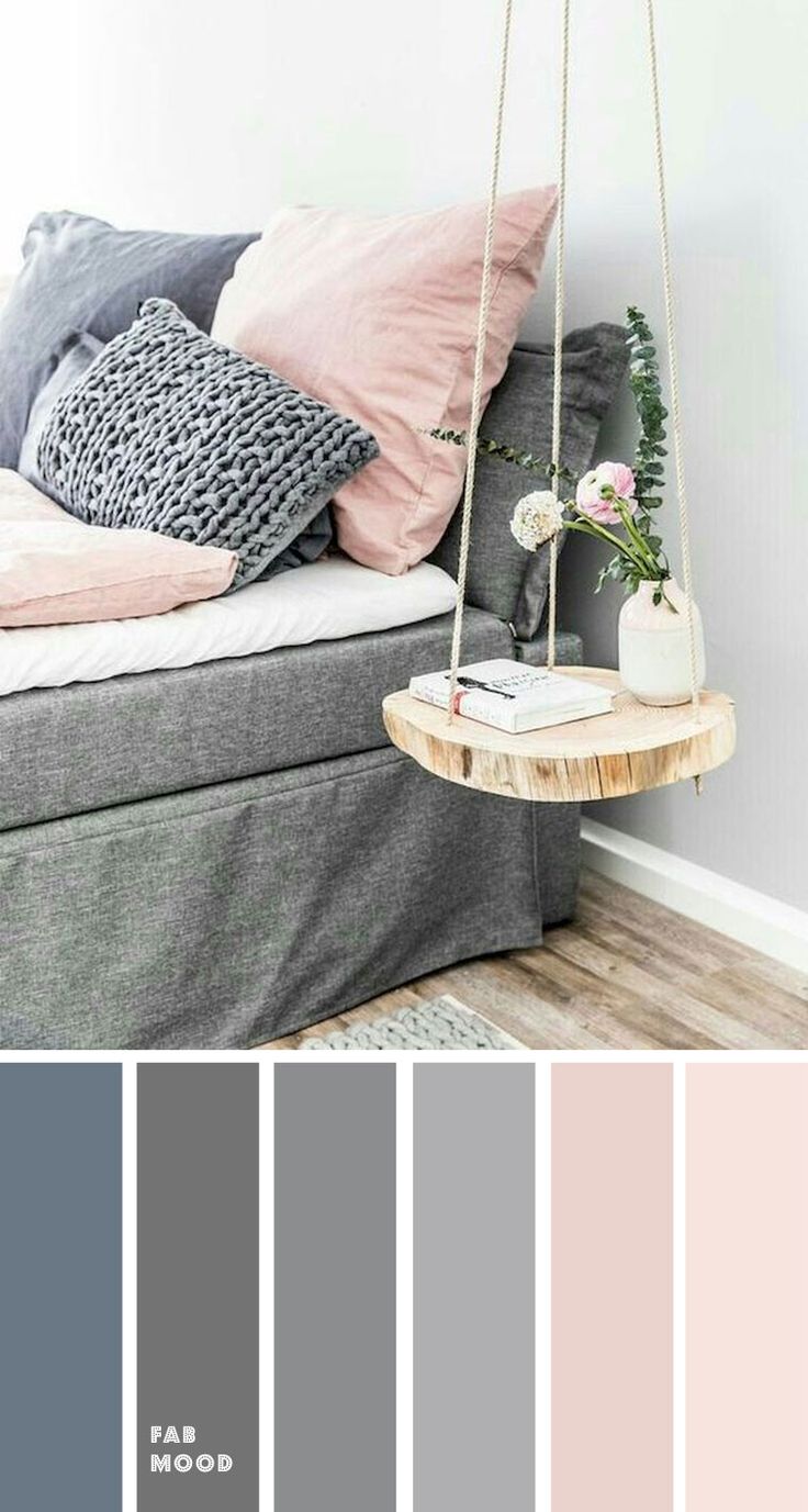 a living room with grey and pink colors